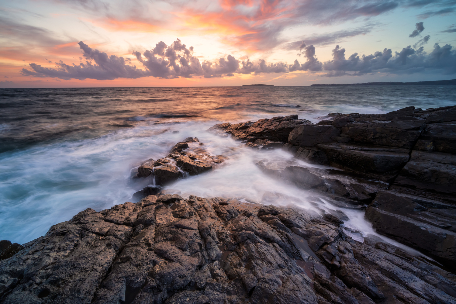 sea sunrise at rocky beach 2022